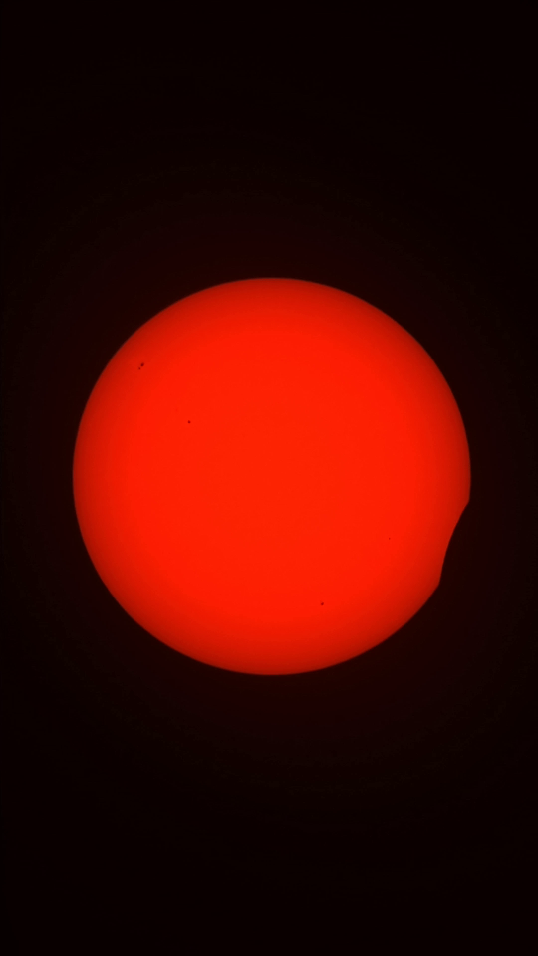 Recorded telescope view of the partially eclipsed Sun